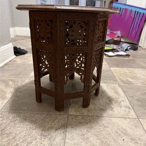 Intricately Carved Brown Wooden Accent Table hand carved from India.